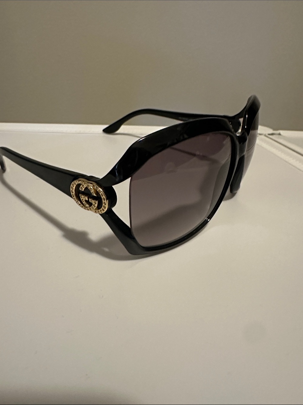 Gucci Black Sunglasses with Gold Double-G Medallions